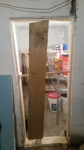 improvised doorframe braced until the insulation hardens